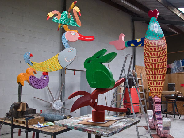 left the Dutch Windmill, in the middle A rabbit has a pair of scissors to think, right the Salmon of Lugh