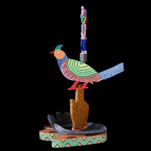 lof der zotheid, een gekleurd beeld van een open hand met daarop het symbool van christus en een kleine figuurtje met een klein vogeltje op hoofd