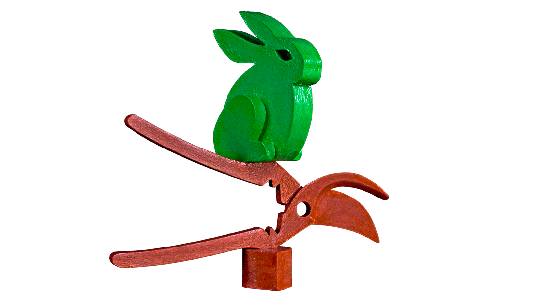 Het Pooltje heeft een schaar on mee te denken. Een groot groen konijn, het Pooltje, zit bovenop de schaar.